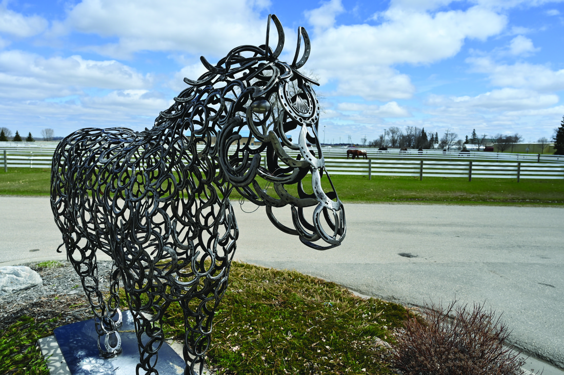Sculpture of horse made with horseshoes