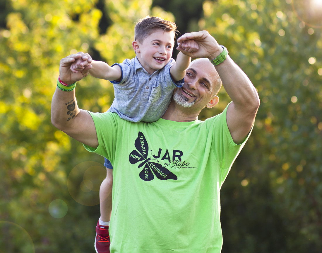 James Raffone holding his son Jamsey on his shoulder